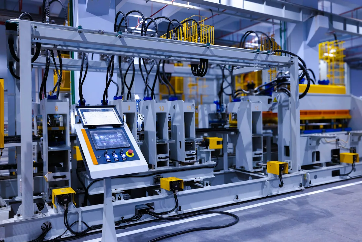Automated manufacturing line with a control panel on the shop floor